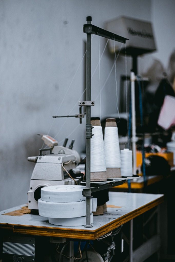 Sewing machines and thread cones on the factory floor - Fenalt local presence